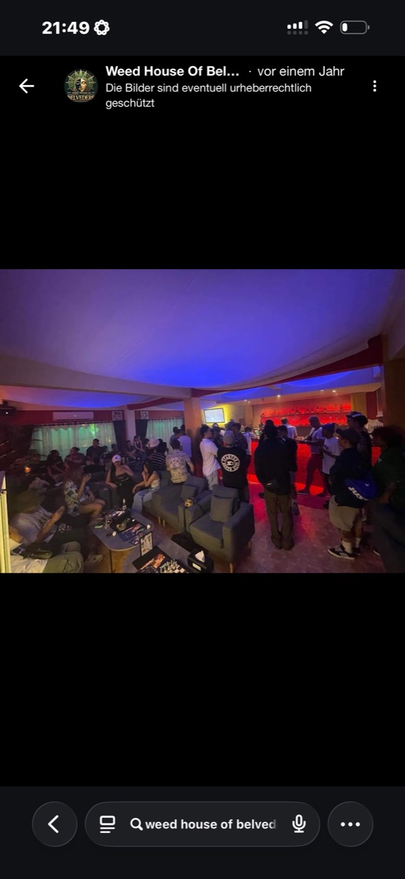 Main bar and dancefloor filled with guests