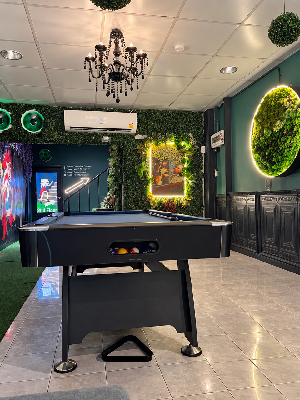 Pool table in the green billiards lounge